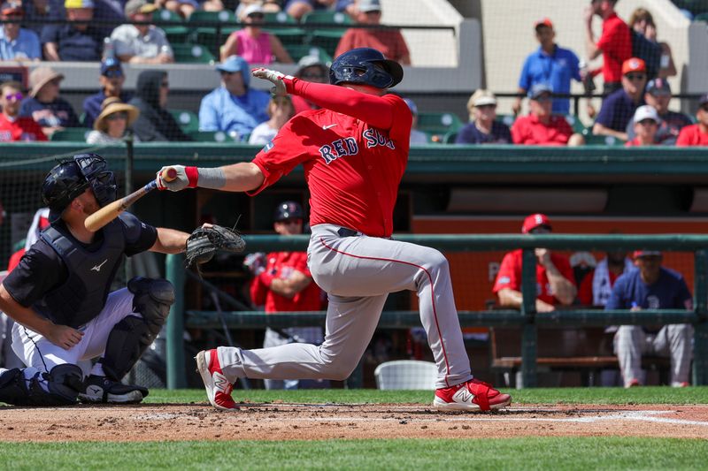 Mar 4, 2024; Lakeland, Florida, USA; Boston Red Sox catcher Reese McGuire (3) bats during the first inning against the Detroit Tigers at Publix Field at Joker Marchant Stadium. Mandatory Credit: Mike Watters-USA TODAY Sports