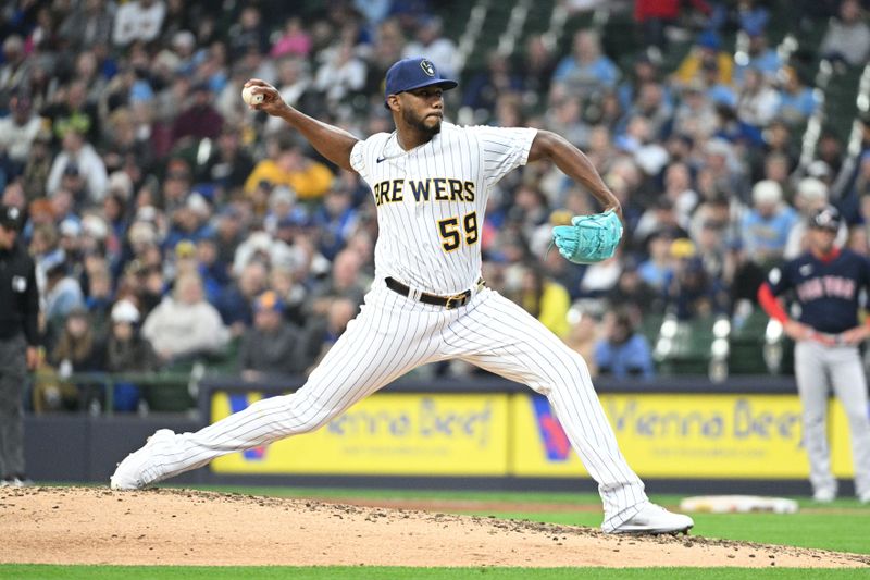 Apr 23, 2023; Milwaukee, Wisconsin, USA; Milwaukee Brewers relief pitcher Elvis Peguero (59) delivers against Boston Red Sox in the seventh inning at American Family Field. Mandatory Credit: Michael McLoone-USA TODAY Sports