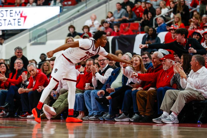 Feb 7, 2026; Raleigh, North Carolina, USA;  NC State Wolfpack guard Quadir Copeland (11) thanks the fans during the second half of the game against the Virginia Tech Hokies at Lenovo Center. Mandatory Credit: Jaylynn Nash-Imagn Images
