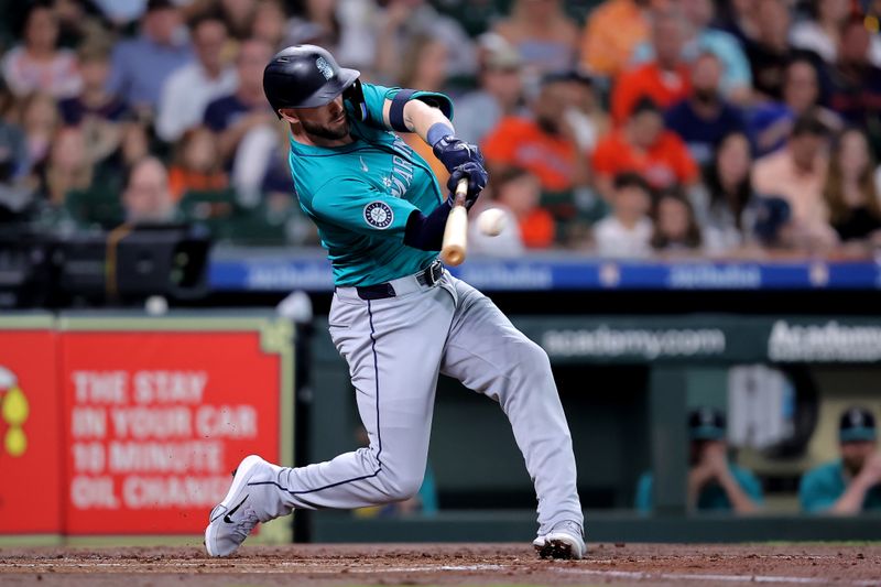 May 4, 2024; Houston, Texas, USA; Seattle Mariners right fielder Mitch Haniger (17) hits a single against the Houston Astros during the second inning at Minute Maid Park. Mandatory Credit: Erik Williams-USA TODAY Sports