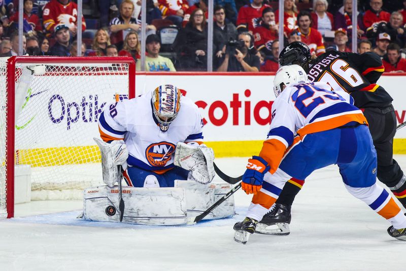 Nov 18, 2023; Calgary, Alberta, CAN; New York Islanders goaltender Ilya Sorokin (30) makes a save against Calgary Flames center Martin Pospisil (76) during the second period at Scotiabank Saddledome. Mandatory Credit: Sergei Belski-USA TODAY Sports