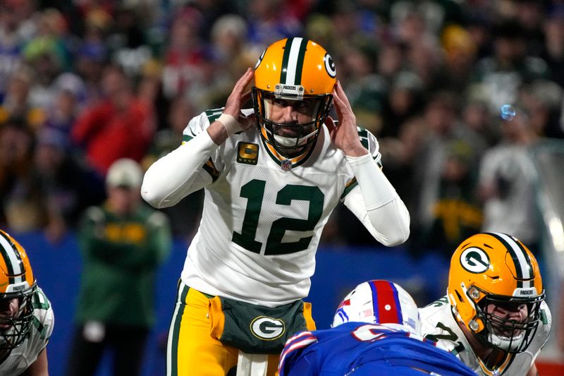 Green Bay Packers quarterback Aaron Rodgers (12) calls out a play against the Buffalo Bills during the first half of an NFL football game, Sunday, Oct. 30, 2022, in Buffalo, New York. (AP Photo/Rick Scuteri)