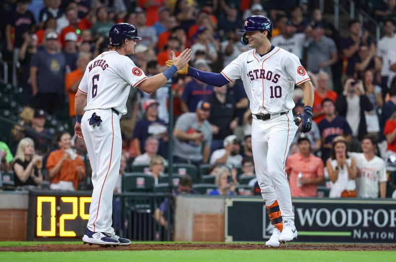 Jul 10, 2024; Houston, Texas, USA; Houston Astros right fielder Joey Loperfido (10) celebrates with center fielder Jake Meyers (6) after hitting a home run during the second inning against the Miami Marlins at Minute Maid Park. Mandatory Credit: Troy Taormina-USA TODAY Sports