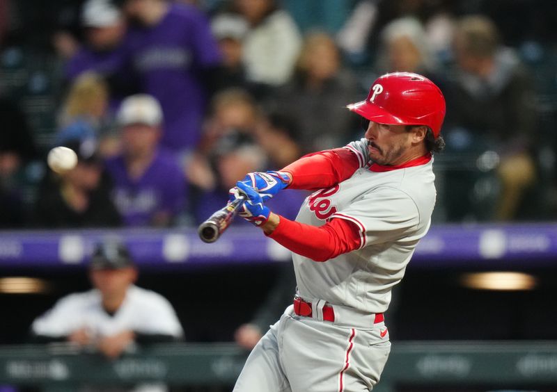 May 12, 2023; Denver, Colorado, USA; Philadelphia Phillies designated hitter Garrett Stubbs (21) doubles in the seventh inning against the Colorado Rockies at Coors Field. Mandatory Credit: Ron Chenoy-USA TODAY Sports