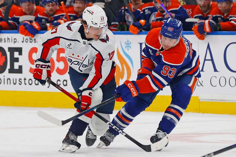 Jan 24, 2026; Edmonton, Alberta, CAN; Washington Capitals forward Dylan Strome (17) and Edmonton Oilers forward Ryan Nugent-Hopkins (93) battle for a loose puck during the second period at Rogers Place. Mandatory Credit: Perry Nelson-Imagn Images