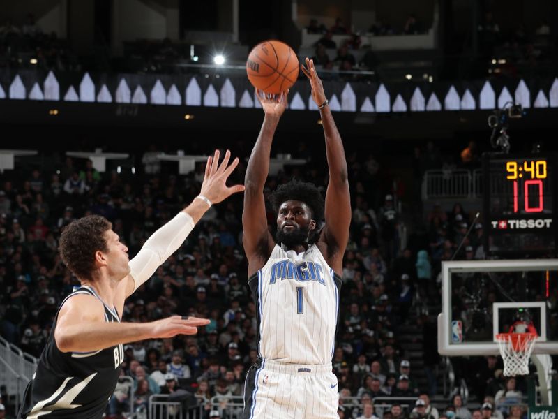 MILWAUKEE, WI - JANUARY 15:  Jonathan Isaac #1 of the Orlando Magic shoots the ball during the game against the Milwaukee Bucks on January 15, 2025 at Fiserv Forum Center in Milwaukee, Wisconsin. NOTE TO USER: User expressly acknowledges and agrees that, by downloading and or using this Photograph, user is consenting to the terms and conditions of the Getty Images License Agreement. Mandatory Copyright Notice: Copyright 2025 NBAE (Photo by Gary Dineen/NBAE via Getty Images).