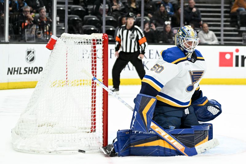 Mar 25, 2023; Anaheim, California, USA; St. Louis Blues goalie Jordan Binnington (50) blocks a shot against the Anaheim Ducks during the third period at Honda Center. Mandatory Credit: Kelvin Kuo-USA TODAY Sports