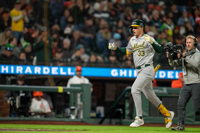 Jul 30, 2024; San Francisco, California, USA;  Oakland Athletics outfielder JJ Bleday (33) celebrates as he crosses home plate during the eighth inning against the San Francisco Giants at Oracle Park. Mandatory Credit: Neville E. Guard-USA TODAY Sports