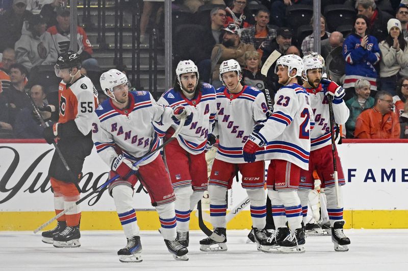 Mar 9, 2026; Philadelphia, Pennsylvania, USA; New York Rangers left wing Alexis Lafrenière (13) skates back to the bench after scoring a goal against the Philadelphia Flyers during the first period at Xfinity Mobile Arena. Mandatory Credit: Eric Hartline-Imagn Images