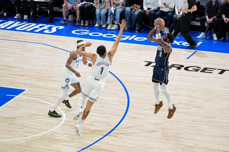 MINNEAPOLIS, MN -  MAY 22: Kyrie Irving #11 of the Dallas Mavericks shoots a three point basket during the game  against the Minnesota Timberwolves during Game 1 of the Western Conference Finals of the 2024 NBA Playoffs on January 1, 2024 at Target Center in Minneapolis, Minnesota. NOTE TO USER: User expressly acknowledges and agrees that, by downloading and or using this Photograph, user is consenting to the terms and conditions of the Getty Images License Agreement. Mandatory Copyright Notice: Copyright 2024 NBAE (Photo by Jordan Johnson/NBAE via Getty Images)