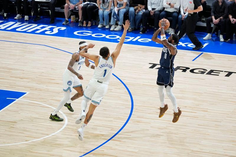 MINNEAPOLIS, MN -  MAY 22: Kyrie Irving #11 of the Dallas Mavericks shoots a three point basket during the game  against the Minnesota Timberwolves during Game 1 of the Western Conference Finals of the 2024 NBA Playoffs on January 1, 2024 at Target Center in Minneapolis, Minnesota. NOTE TO USER: User expressly acknowledges and agrees that, by downloading and or using this Photograph, user is consenting to the terms and conditions of the Getty Images License Agreement. Mandatory Copyright Notice: Copyright 2024 NBAE (Photo by Jordan Johnson/NBAE via Getty Images)