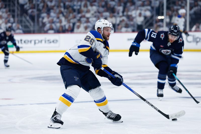 Apr 30, 2025; Winnipeg, Manitoba, CAN; St. Louis Blues forward Nathan Walker (26) skates away from Winnipeg Jets forward Gabriel Vilardi (13) during the first period in game five of the first round of the 2025 Stanley Cup Playoffs at Canada Life Centre. Mandatory Credit: Terrence Lee-Imagn Images