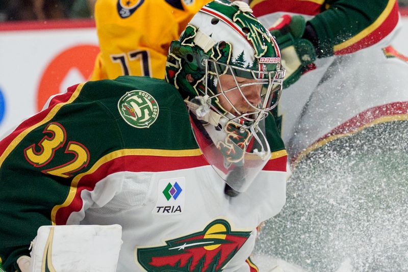 Nov 4, 2025; Saint Paul, Minnesota, USA; Minnesota Wild goaltender Filip Gustavsson (32) stops a hard shot by the Nashville Predators in the first period at Grand Casino Arena. Mandatory Credit: Matt Blewett-Imagn Images