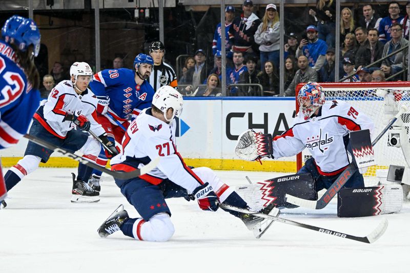 Apr 23, 2024; New York, New York, USA;  New York Rangers center Mika Zibanejad (93) shoots and scores a goal past Washington Capitals goaltender Charlie Lindgren (79) during the first period in game two of the first round of the 2024 Stanley Cup Playoffs at Madison Square Garden. Mandatory Credit: Dennis Schneidler-USA TODAY Sports