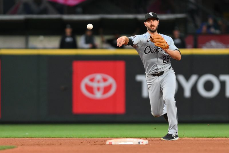 Jun 11, 2024; Seattle, Washington, USA; Chicago White Sox shortstop Paul DeJong (29) throws to first base for a force out against the Seattle Mariners during the seventh inning at T-Mobile Park. Mandatory Credit: Steven Bisig-USA TODAY Sports