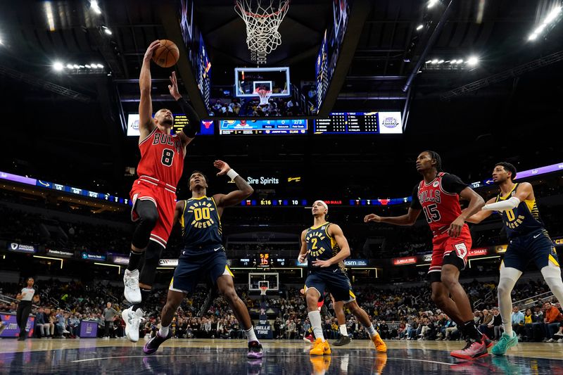 INDIANAPOLIS, INDIANA - JANUARY 08: Zach LaVine #8 of the Chicago Bulls shoots against Bennedict Mathurin #00 of the Indiana Pacers during an NBA basketball game at Gainbridge Fieldhouse on January 08, 2025 in Indianapolis, Indiana. NOTE TO USER: User expressly acknowledges and agrees that, by downloading and or using this Photograph, user is consenting to the terms and conditions of the Getty Images License Agreement. (Photo by Jeff Dean/Getty Images)