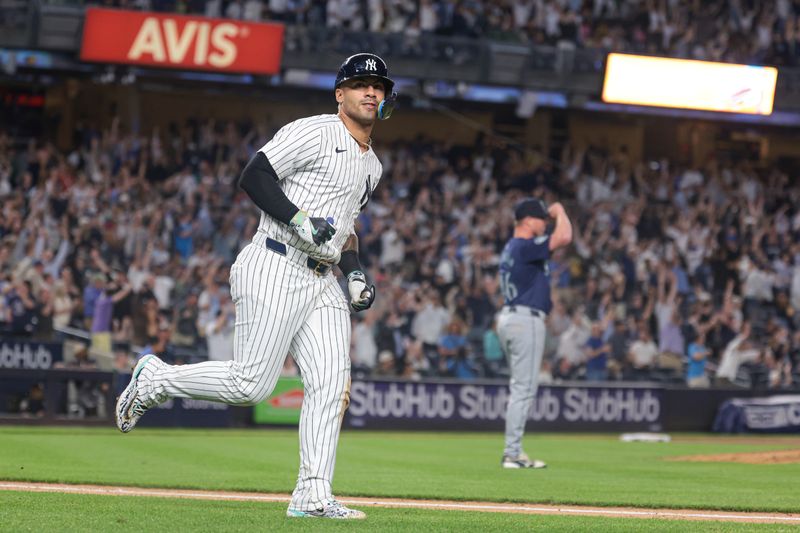 May 21, 2024; Bronx, New York, USA;  New York Yankees second baseman Gleyber Torres (25) reacts after hitting a three run home run against Seattle Mariners relief pitcher Trent Thornton (46) during the seventh inning at Yankee Stadium. Mandatory Credit: Vincent Carchietta-USA TODAY Sports