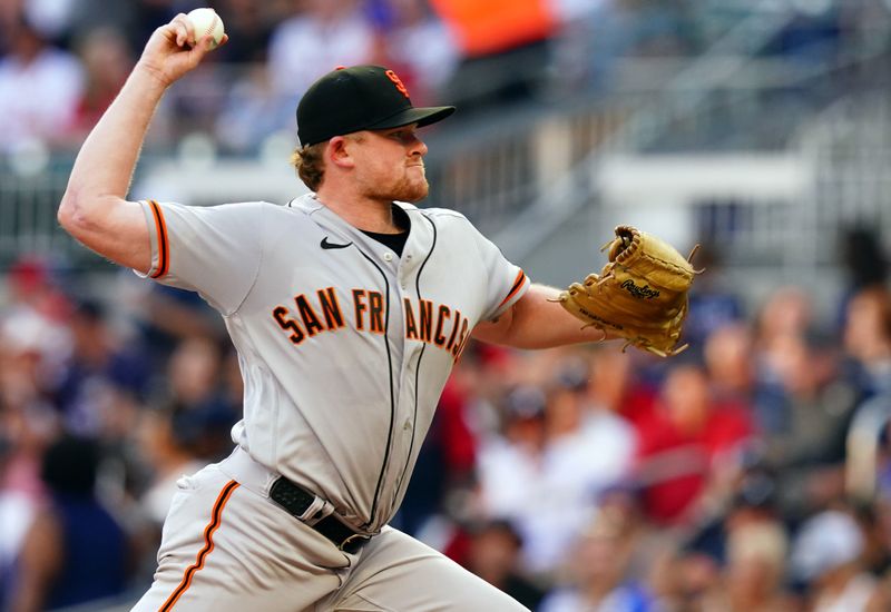 Aug 19, 2023; Cumberland, Georgia, USA; San Francisco Giants starting pitcher Logan Webb (62). Pitches against the Atlanta Braves during the first inning at Truist Park. Mandatory Credit: John David Mercer-USA TODAY Sports