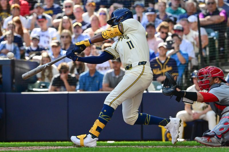 Sep 2, 2024; Milwaukee, Wisconsin, USA; Milwaukee Brewers left fielder Jackson Chourio (11) hits a grand slam home run in the sixth inning against the St. Louis Cardinals at American Family Field. Mandatory Credit: Benny Sieu-USA TODAY Sports