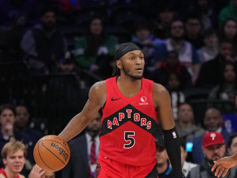 PHILADELPHIA, PA - FEBRUARY 11:  Immanuel Quickley #5 of the Toronto Raptors dribbles the ball during the game against the Philadelphia 76ers  on February 11, 2025 at the Wells Fargo Center in Philadelphia, Pennsylvania NOTE TO USER: User expressly acknowledges and agrees that, by downloading and/or using this Photograph, user is consenting to the terms and conditions of the Getty Images License Agreement. Mandatory Copyright Notice: Copyright 2025 NBAE (Photo by Jesse D. Garrabrant/NBAE via Getty Images)