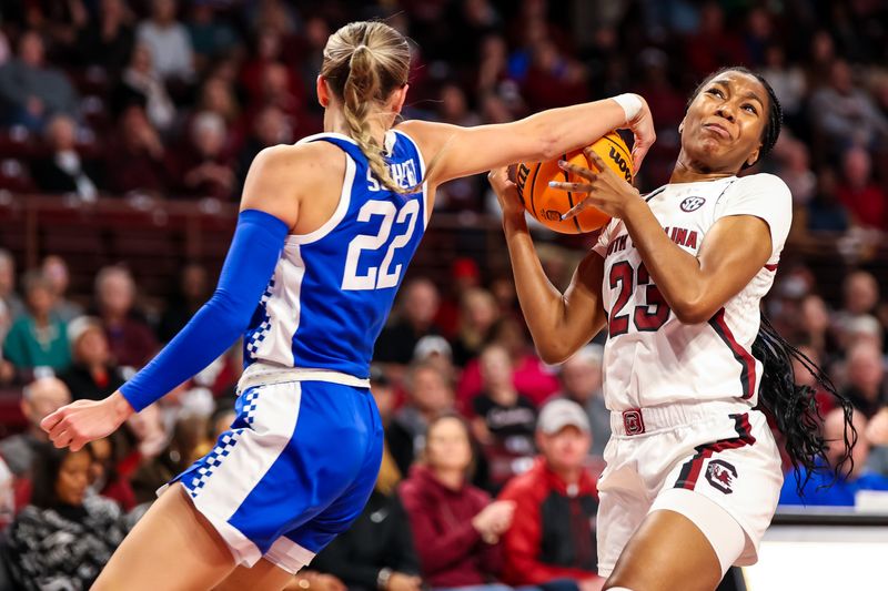 Feb 2, 2023; Columbia, South Carolina, USA; Kentucky Wildcats guard Maddie Scherr (22) ties up South Carolina Gamecocks guard Bree Hall (23) in the first half at Colonial Life Arena. Mandatory Credit: Jeff Blake-USA TODAY Sports