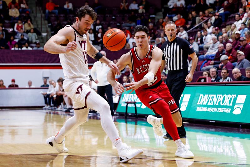 Jan 15, 2025; Blacksburg, Virginia, USA; Virginia Tech Hokies forward Ben Burnham (13) kicks the ball on a pass from North Carolina State Wolfpack guard Michael O'Connell (12) during the second half at Cassell Coliseum. Mandatory Credit: Peter Casey-Imagn Images