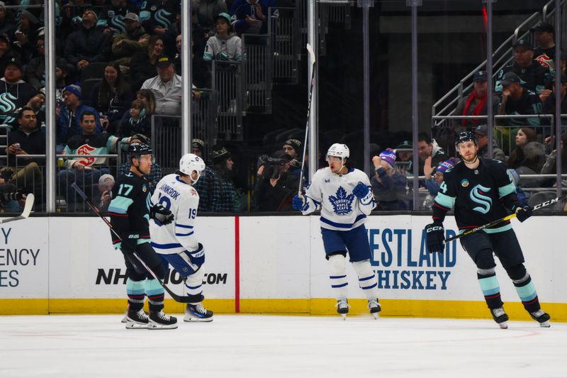 Jan 21, 2024; Seattle, Washington, USA; Toronto Maple Leafs left wing Nicholas Robertson (89) celebrates after scoring a goal against the Seattle Kraken during the second period at Climate Pledge Arena. Mandatory Credit: Steven Bisig-USA TODAY Sports