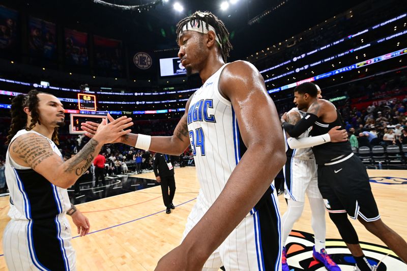 LOS ANGELES, CA - MARCH 18: Cole Anthony #50 of the Orlando Magic high fives Wendell Carter Jr. #34 after the game on March 18, 2023 at Crypto.Com Arena in Los Angeles, California. NOTE TO USER: User expressly acknowledges and agrees that, by downloading and/or using this Photograph, user is consenting to the terms and conditions of the Getty Images License Agreement. Mandatory Copyright Notice: Copyright 2023 NBAE (Photo by Adam Pantozzi/NBAE via Getty Images)