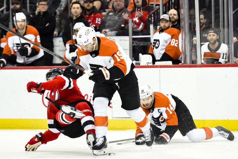 Jan 29, 2025; Newark, New Jersey, USA; Philadelphia Flyers right wing Garnet Hathaway (19) checks New Jersey Devils defenseman Luke Hughes (43) during the first period at Prudential Center. Mandatory Credit: John Jones-Imagn Images