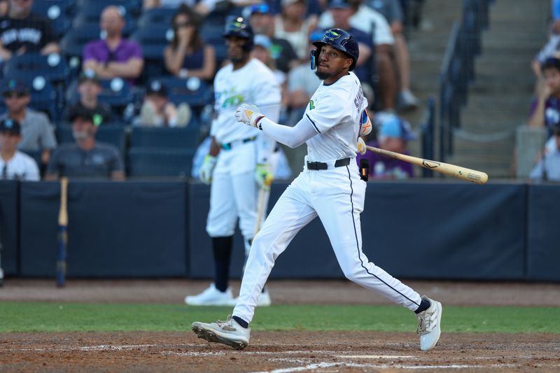 Apr 19, 2025; Tampa, Florida, USA; Tampa Bay Rays center fielder Chandler Simpson (14) doubles against the New York Yankees in the ninth inning at George M. Steinbrenner Field. Mandatory Credit: Nathan Ray Seebeck-Imagn Images