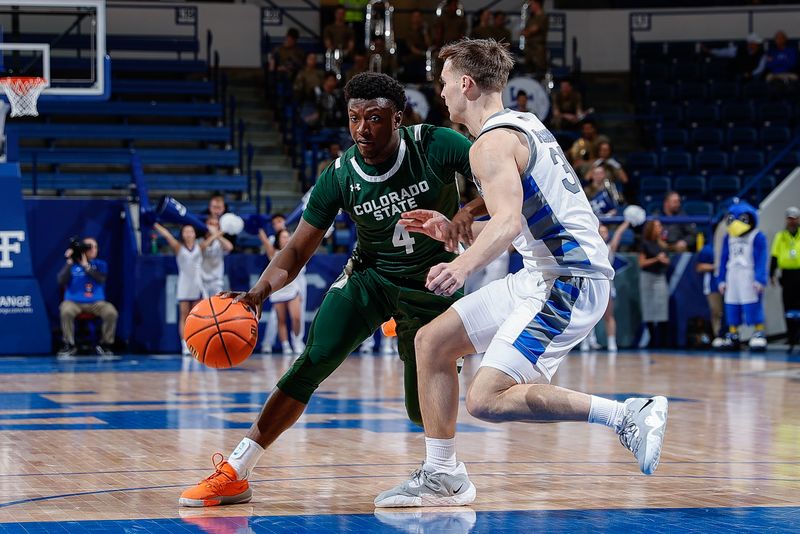 Feb 7, 2023; Colorado Springs, Colorado, USA; Colorado State Rams guard Isaiah Stevens (4) controls the ball as Air Force Falcons guard Camden Vander Zwaag (30) guards in the first half at Clune Arena. Mandatory Credit: Isaiah J. Downing-USA TODAY Sports