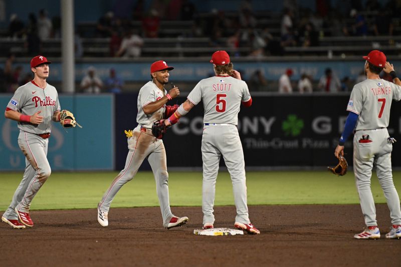 May 8, 2025; St. Petersburg, Florida, USA;  Members of the Philadelphia Phillies celebrate after defeating the Tampa Bay Rays at George M. Steinbrenner Field. Mandatory Credit: Jonathan Dyer-Imagn Images