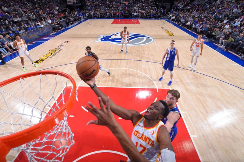 SACRAMENTO, CA - JANUARY 22: Onyeka Okongwu #17 of the Atlanta Hawks drives to the basket during the game against the Sacramento Kings on January 22, 2024 at Golden 1 Center in Sacramento, California. NOTE TO USER: User expressly acknowledges and agrees that, by downloading and or using this Photograph, user is consenting to the terms and conditions of the Getty Images License Agreement. Mandatory Copyright Notice: Copyright 2024 NBAE (Photo by Rocky Widner/NBAE via Getty Images)