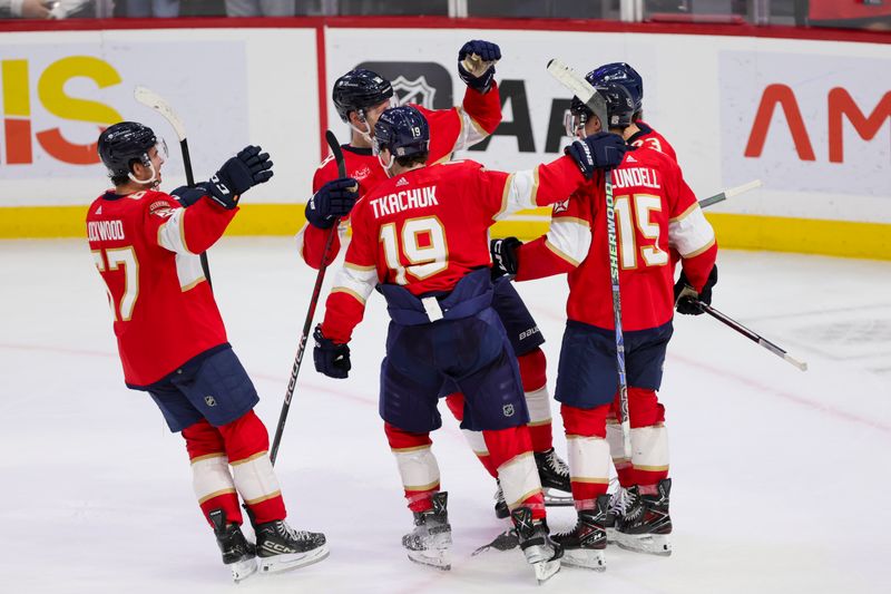 Nov 6, 2023; Sunrise, Florida, USA; Florida Panthers left wing Matthew Tkachuk (19) celebrates with teammates after winning the game against the Columbus Blue Jackets at Amerant Bank Arena. Mandatory Credit: Sam Navarro-USA TODAY Sports