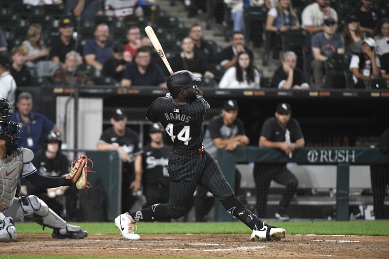 Sep 9, 2024; Chicago, Illinois, USA;  Chicago White Sox designated hitter Bryan Ramos (44) hits a two-run home run against the Cleveland Guardians during the eighth inning at Guaranteed Rate Field. Mandatory Credit: Matt Marton-Imagn Images