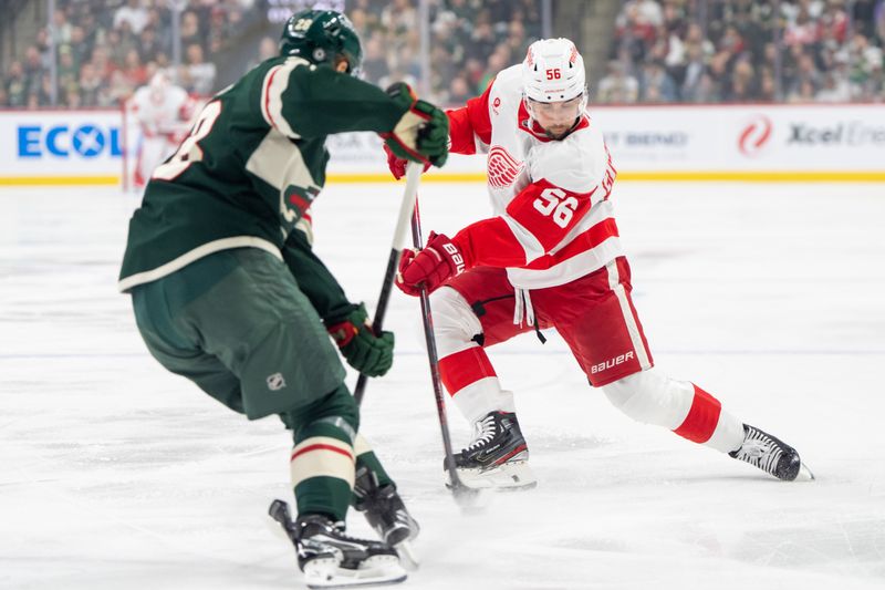 Feb 25, 2025; Saint Paul, Minnesota, USA; Detroit Red Wings defenseman Erik Gustafsson (56) shoots against Minnesota Wild left wing Liam Ohgren (28) in the first period at Xcel Energy Center. Mandatory Credit: Matt Blewett-Imagn Images