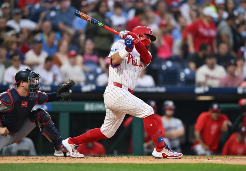 Aug 17, 2024; Philadelphia, Pennsylvania, USA; Philadelphia Phillies designated hitter Kyle Schwarber (12) hits a single against the Washington Nationals in the first inning at Citizens Bank Park. Mandatory Credit: Kyle Ross-USA TODAY Sports