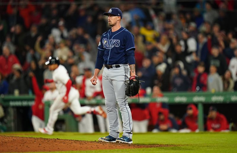 Sep 26, 2023; Boston, Massachusetts, USA; Tampa Bay Rays relief pitcher Shawn Armstrong (64) looks on as Boston Red Sox second baseman Enmanuel Valdez (47) hits a double to drive in a run in the eighth inning at Fenway Park. Mandatory Credit: David Butler II-USA TODAY Sports