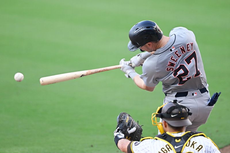 Sep 2, 2024; San Diego, California, USA; Detroit Tigers shortstop Trey Sweeney (27) hits a single during the sixth inning against the San Diego Padres at Petco Park. Mandatory Credit: Denis Poroy-USA TODAY Sports