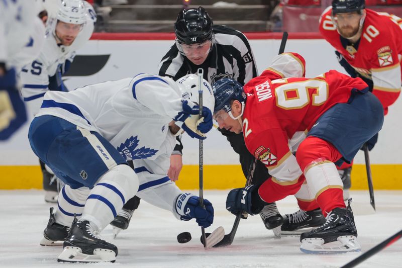 May 16, 2025; Sunrise, Florida, USA; Florida Panthers left wing Tomas Nosek (92) and Toronto Maple Leafs center Max Domi (11) face-off during the second period in game six of the second round of the 2025 Stanley Cup Playoffs at Amerant Bank Arena. Mandatory Credit: Sam Navarro-Imagn Images