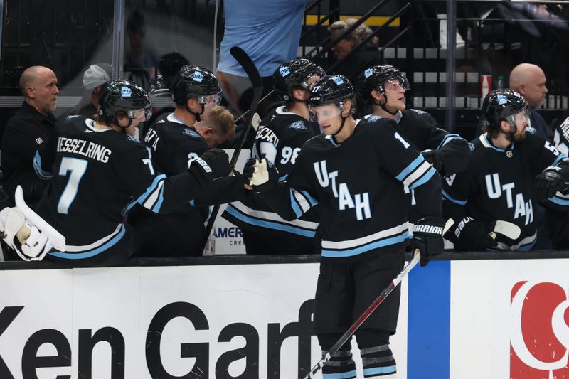 Nov 13, 2024; Salt Lake City, Utah, USA; Utah Hockey Club center Nick Bjugstad (17) celebrates with the bench after scoring a goal against the Carolina Hurricanes during the first period at Delta Center. Mandatory Credit: Rob Gray-Imagn Images