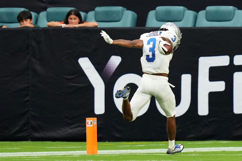 Sep 24, 2022; Miami Gardens, Florida, USA; Middle Tennessee Blue Raiders wide receiver DJ England-Chisolm (3) runs for a touchdown after a catch against the Miami Hurricanes during the second half at Hard Rock Stadium. Mandatory Credit: Jasen Vinlove-USA TODAY Sports