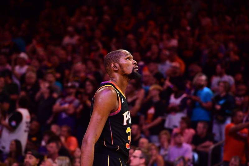 PHOENIX, AZ - APRIL  16: Kevin Durant #35 of the Phoenix Suns looks on during Round One Game One of the 2023 NBA Playoffs on April 16, 2023 at Footprint Center in Phoenix, Arizona. NOTE TO USER: User expressly acknowledges and agrees that, by downloading and or using this photograph, user is consenting to the terms and conditions of the Getty Images License Agreement. Mandatory Copyright Notice: Copyright 2023 NBAE (Photo by Kate Frese/NBAE via Getty Images)