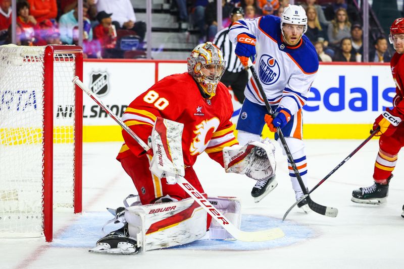 Sep 23, 2024; Calgary, Alberta, CAN; Calgary Flames goaltender Dan Vladar (80) guards his net against the Edmonton Oilers during the first period at Scotiabank Saddledome. Mandatory Credit: Sergei Belski-Imagn Images