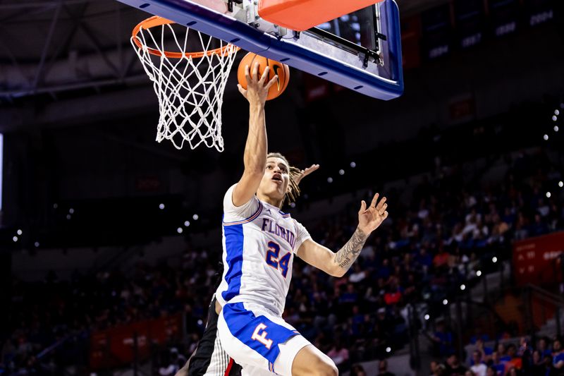 Jan 7, 2023; Gainesville, Florida, USA; Florida Gators guard Riley Kugel (24) makes a layup during the second half against the Georgia Bulldogs at Exactech Arena at the Stephen C. O'Connell Center. Mandatory Credit: Matt Pendleton-USA TODAY Sports