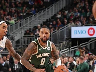 MILWAUKEE, WI - DECEMBER 21:  Damian Lillard #0 of the Milwaukee Bucks handles the ball during the game against the Orlando Magic on December 21, 2023 at the Fiserv Forum Center in Milwaukee, Wisconsin. NOTE TO USER: User expressly acknowledges and agrees that, by downloading and or using this Photograph, user is consenting to the terms and conditions of the Getty Images License Agreement. Mandatory Copyright Notice: Copyright 2023 NBAE (Photo by Gary Dineen/NBAE via Getty Images).