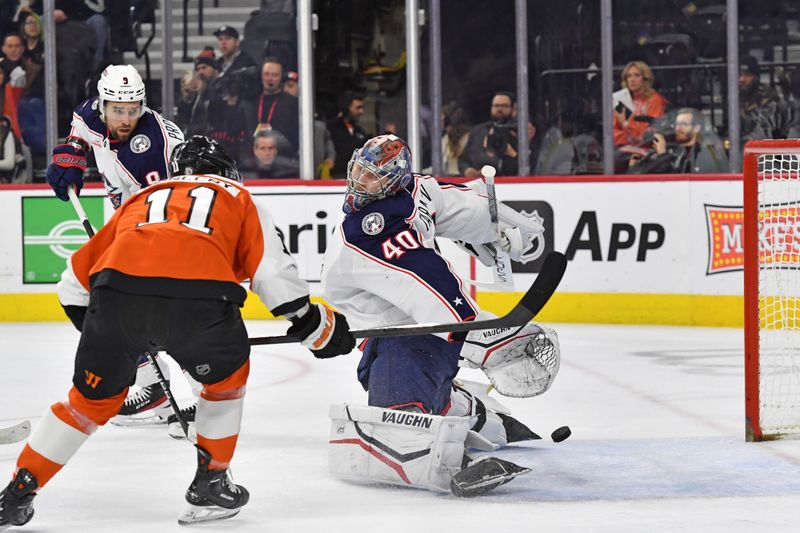 Jan 4, 2024; Philadelphia, Pennsylvania, USA;  Philadelphia Flyers right wing Travis Konecny (11) scores a goal against Columbus Blue Jackets goaltender Daniil Tarasov (40) during the first period at Wells Fargo Center. Mandatory Credit: Eric Hartline-USA TODAY Sports