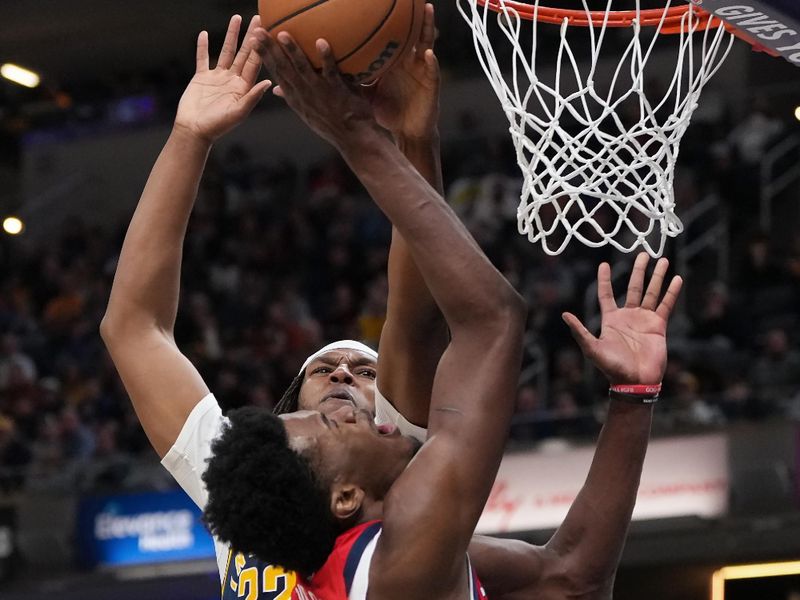 INDIANAPOLIS, INDIANA - NOVEMBER 25: Yves Missi #21 of the New Orleans Pelicans attempts a layup while being guarded by Myles Turner #33 of the Indiana Pacers in the fourth quarter at Gainbridge Fieldhouse on November 25, 2024 in Indianapolis, Indiana. NOTE TO USER: User expressly acknowledges and agrees that, by downloading and or using this photograph, User is consenting to the terms and conditions of the Getty Images License Agreement. (Photo by Dylan Buell/Getty Images)