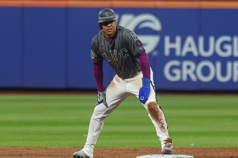 May 25, 2025; New York City, New York, USA; New York Mets right fielder Juan Soto (22) stands on second base after a stolen base during the third inning against the Los Angeles Dodgers at Citi Field. Mandatory Credit: Vincent Carchietta-Imagn Images