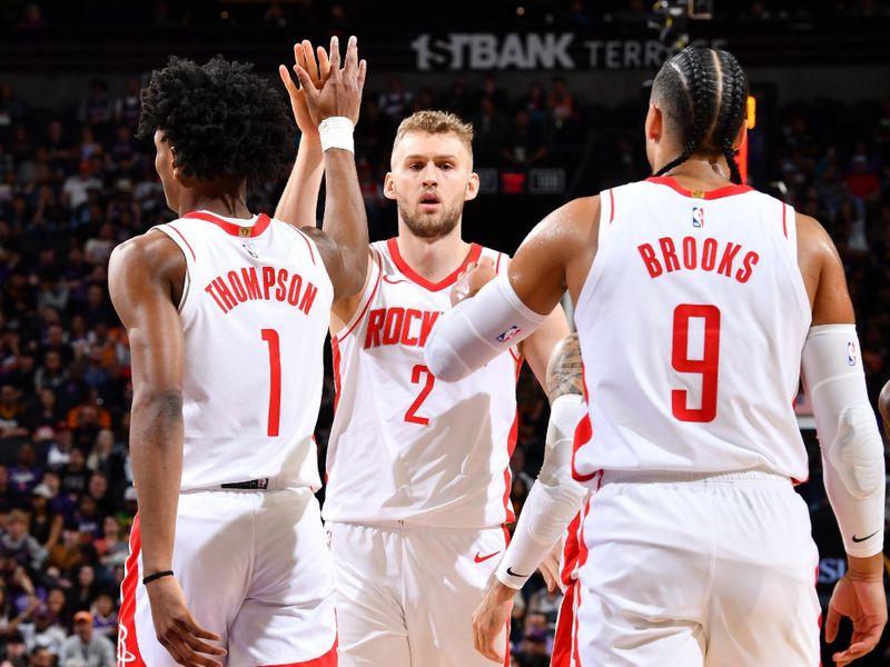 PHOENIX, AZ - MARCH 2: Jock Landale #2, Amen Thompson #1 and Dillon Brooks #9 of the Houston Rockets high five during the game against the Phoenix Suns on March 2, 2024 at Footprint Center in Phoenix, Arizona. NOTE TO USER: User expressly acknowledges and agrees that, by downloading and or using this photograph, user is consenting to the terms and conditions of the Getty Images License Agreement. Mandatory Copyright Notice: Copyright 2024 NBAE (Photo by Barry Gossage/NBAE via Getty Images)